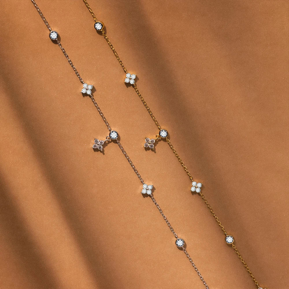 Close up of Aurelia Zircon flower pendant on link chain