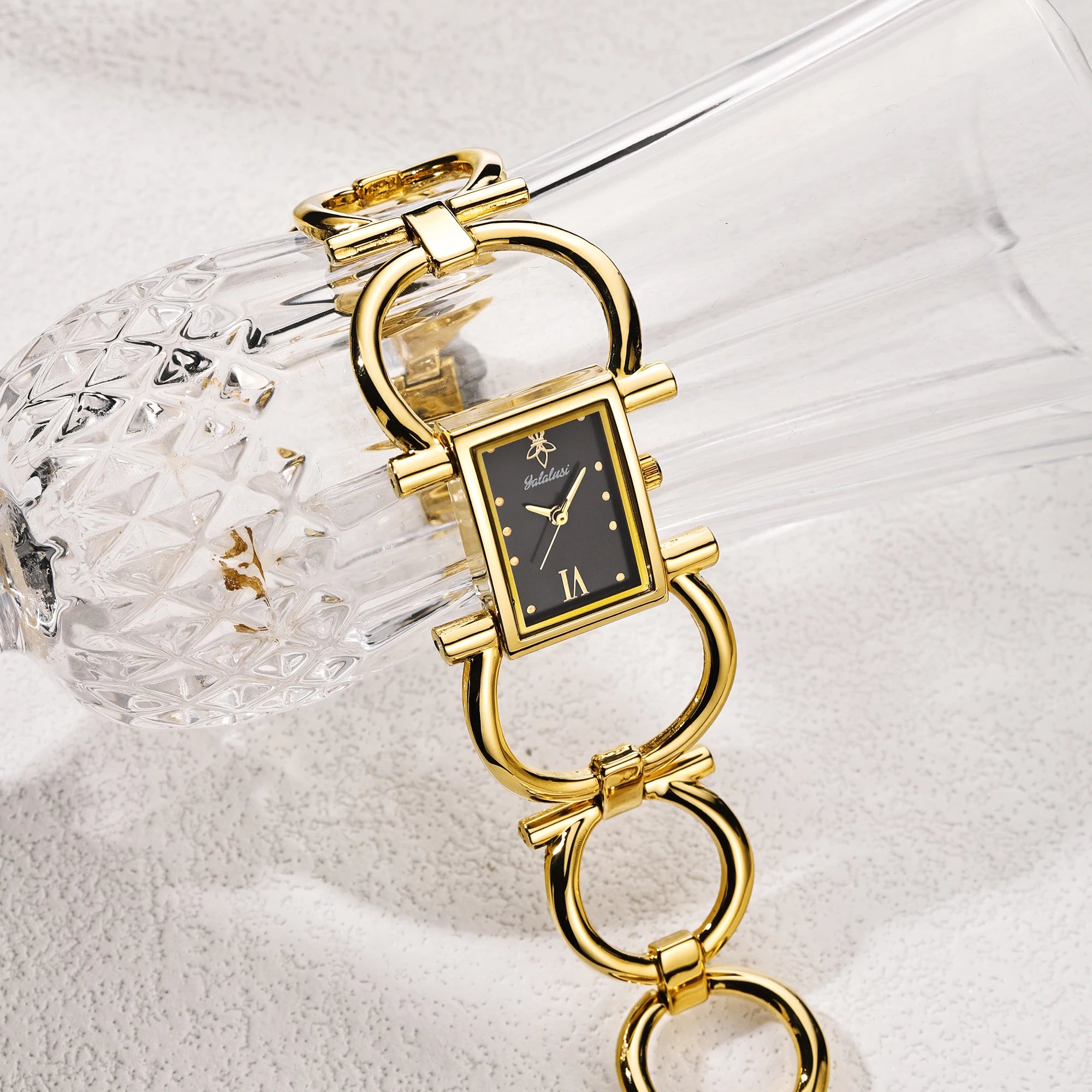 Gold case with black dial, ion-plated link bracelet, numberless face