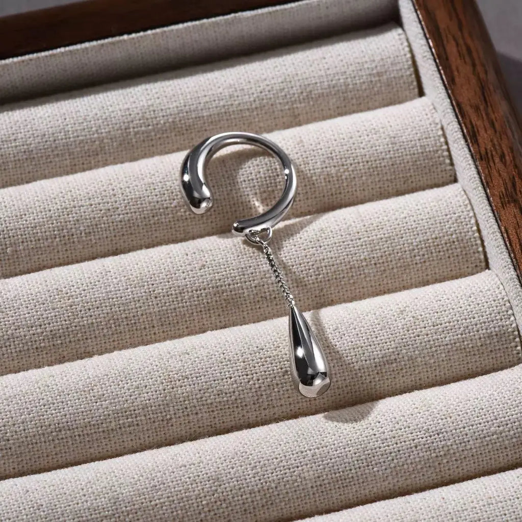 Clip earring showing silver plating and detail