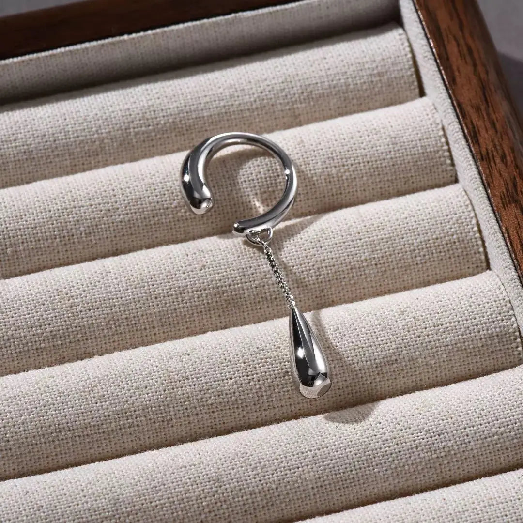 Clip earring showing silver plating and detail
