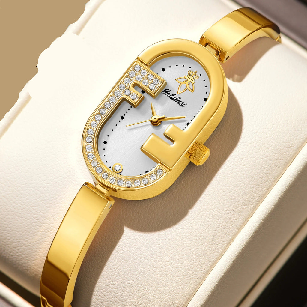 Gold case with white dial and rhinestone accents, adjustable gold link bracelet, numberless face, hook buckle clasp
