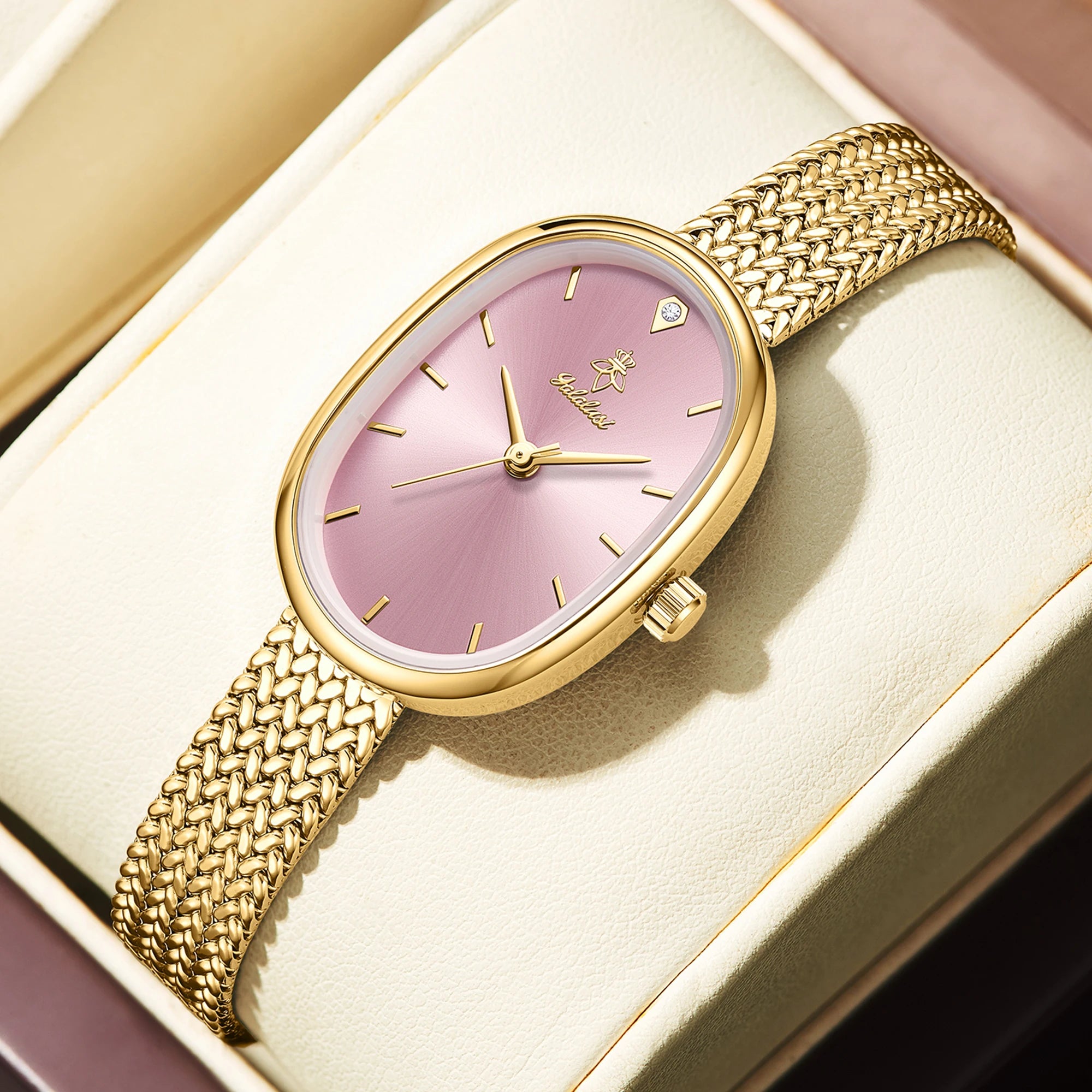  Gold case with pink dial, slim band, numberless face, hook buckle clasp