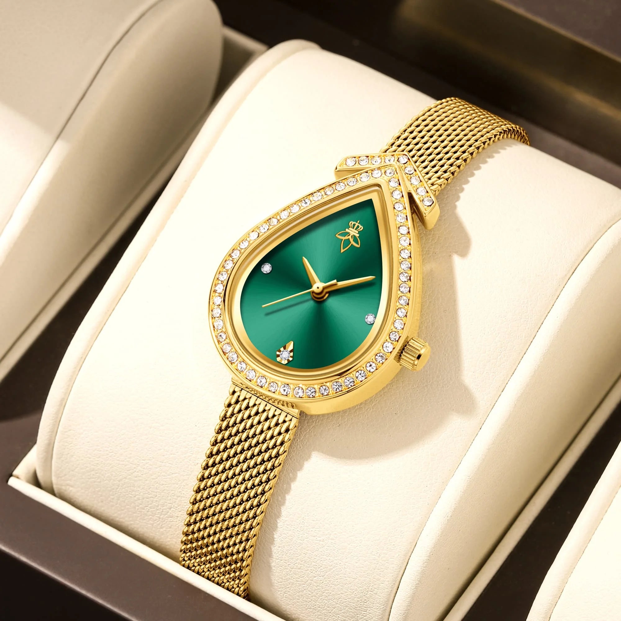 Golden case with green dial, minimalist numberless face, hook buckle clasp