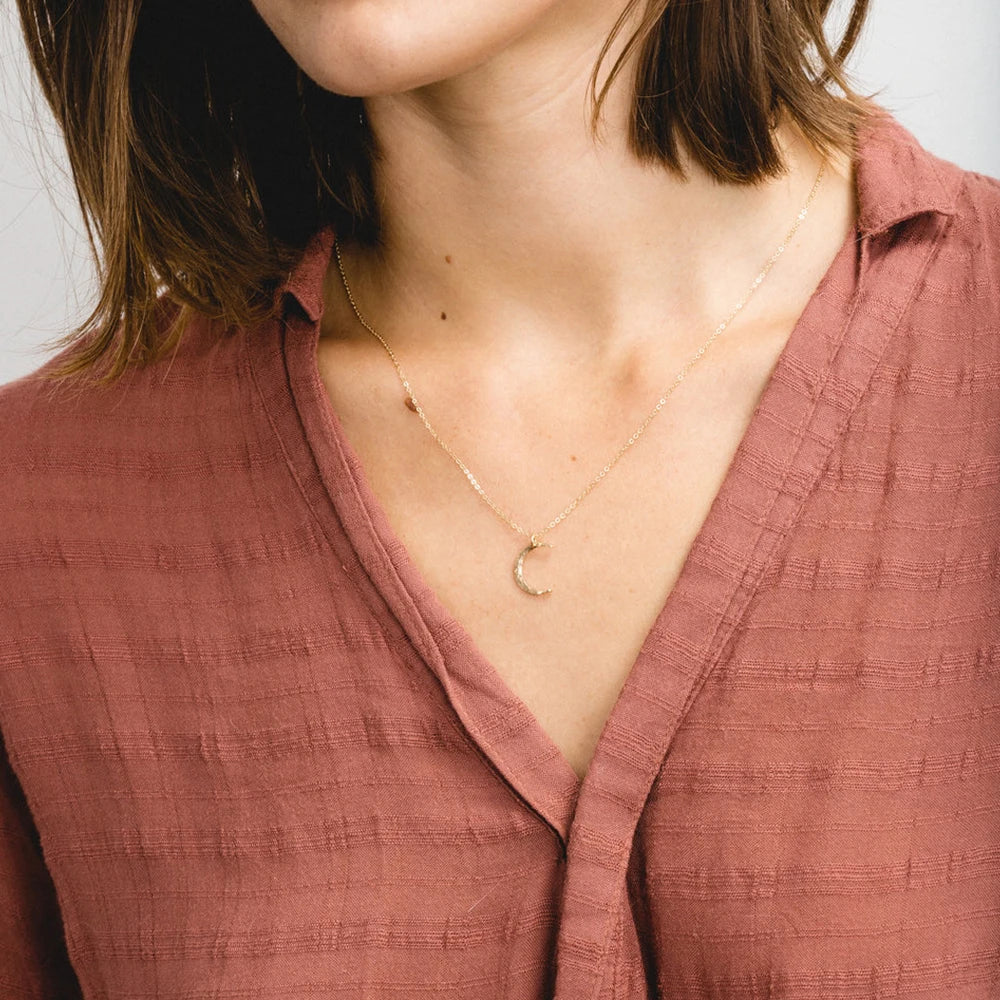 Elegant moon necklace for women featuring a premium stainless steel pendant with a minimalist celestial design, tarnish-resistant finish, and versatile styling for everyday fashion jewelry looks.