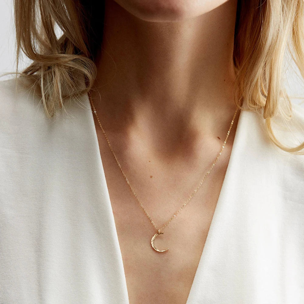 Elegant moon necklace for women featuring a premium stainless steel pendant with a minimalist celestial design, tarnish-resistant finish, and versatile styling for everyday fashion jewelry looks.
