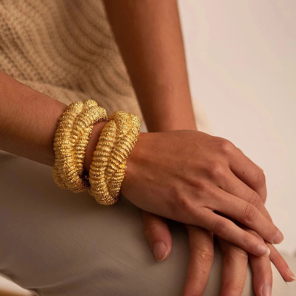 Gold bangle bracelet close up detail