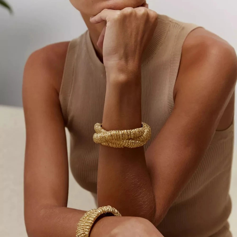 18k gold plated geometric opening bangle on wrist