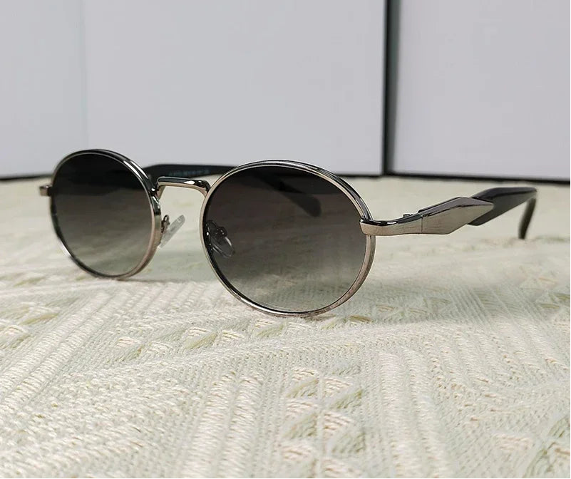 Mirage oval sunglasses in gray and green gradient lenses"