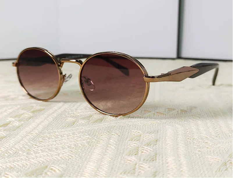 Mirage oval sunglasses in gold and brown gradient lenses