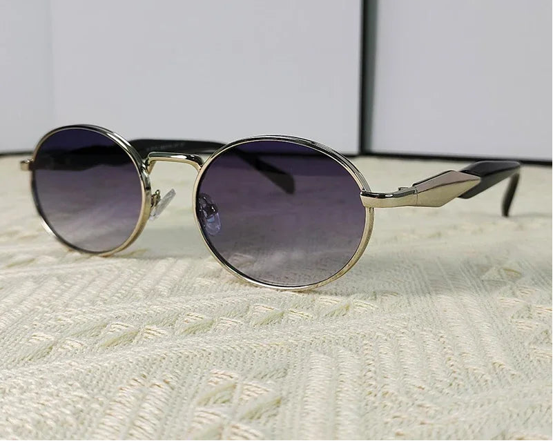 Mirage oval sunglasses in silver and gray gradient lenses