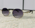 Mirage oval sunglasses in silver and gray gradient lenses