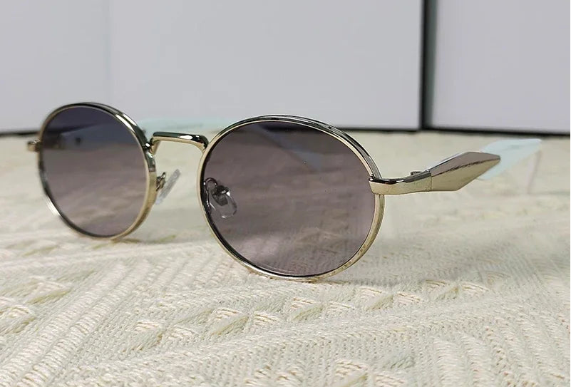 Mirage oval sunglasses in white and gray gradient lenses