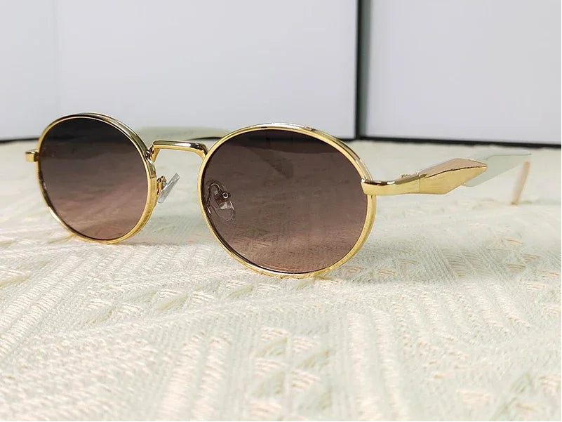 Mirage oval sunglasses in gray and pink gradient lenses