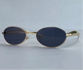Soleil oval sunglasses in gold and gray gradient lenses