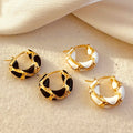 Black and white hoop earring styled together