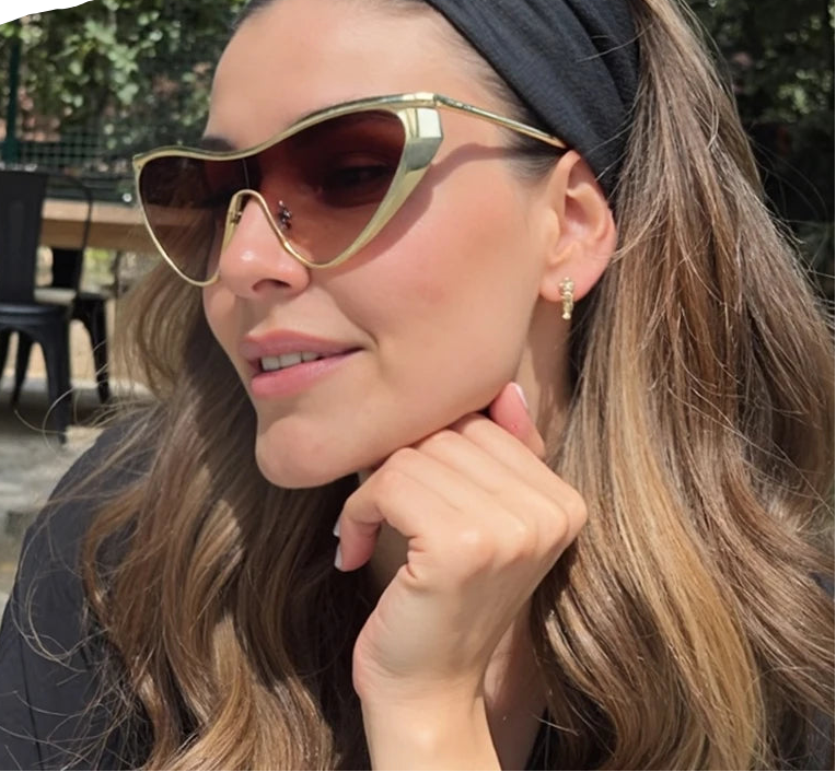 "Velour sunglasses styled on model showing oversized oval silhouette