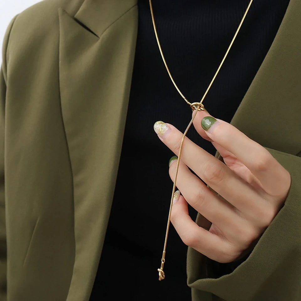Geometric pendant stainless steel link chain necklace close up